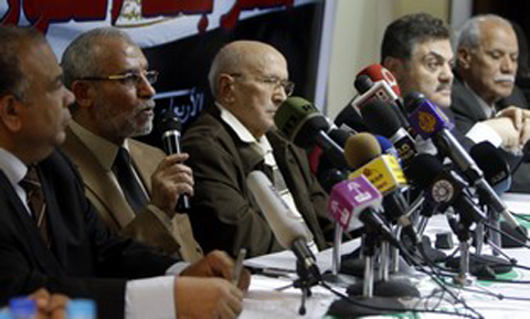 Muslim Brotherhood leader Badie speaks during a news conference on proposed changes to the constitution in Cairo